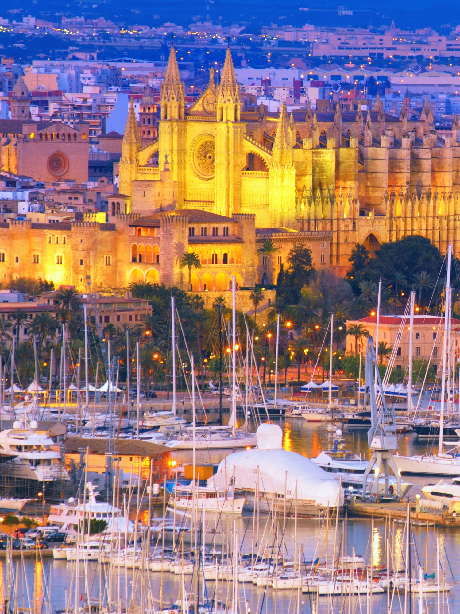 a large building with many boats in a harbor