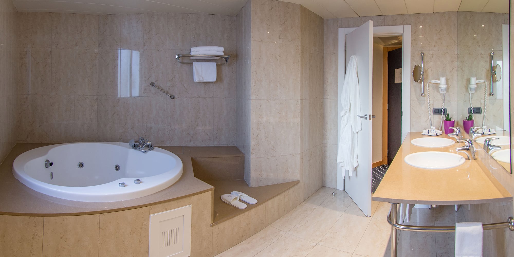 a bathroom with a bathtub and a sink