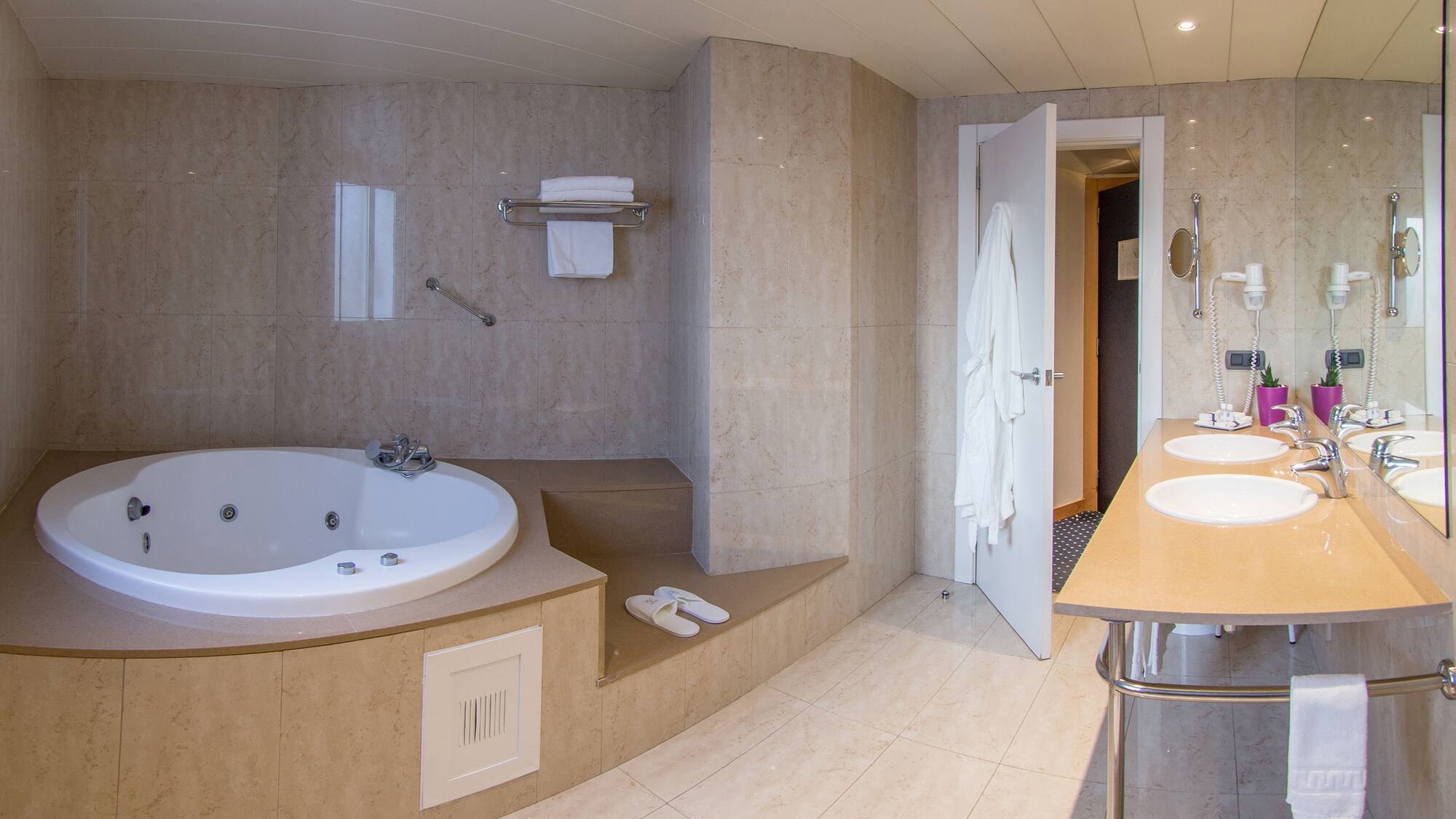 a bathroom with a bathtub and a sink