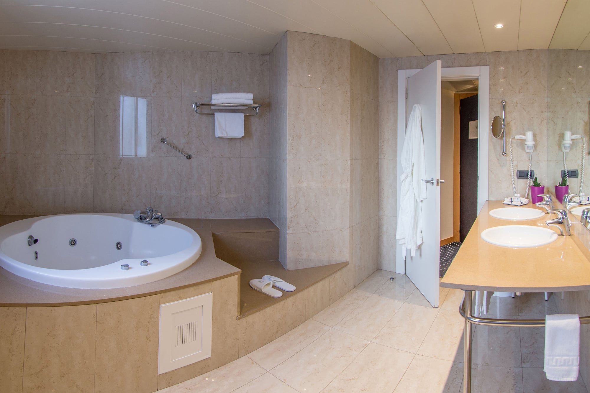 a bathroom with a bathtub and a sink