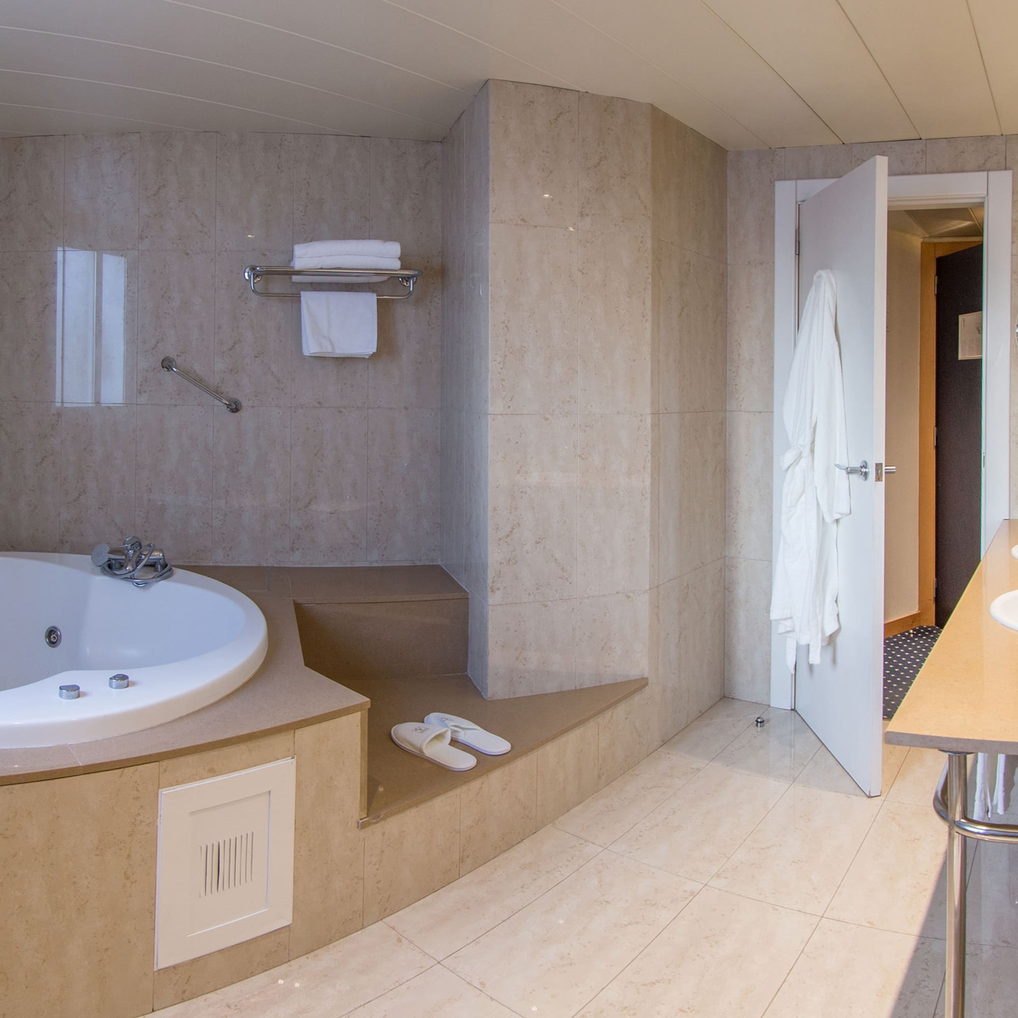 a bathroom with a bathtub and a sink