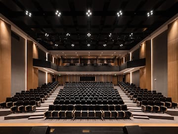 a large auditorium with rows of chairs