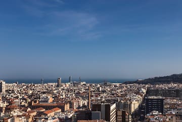 a city with many buildings and a body of water