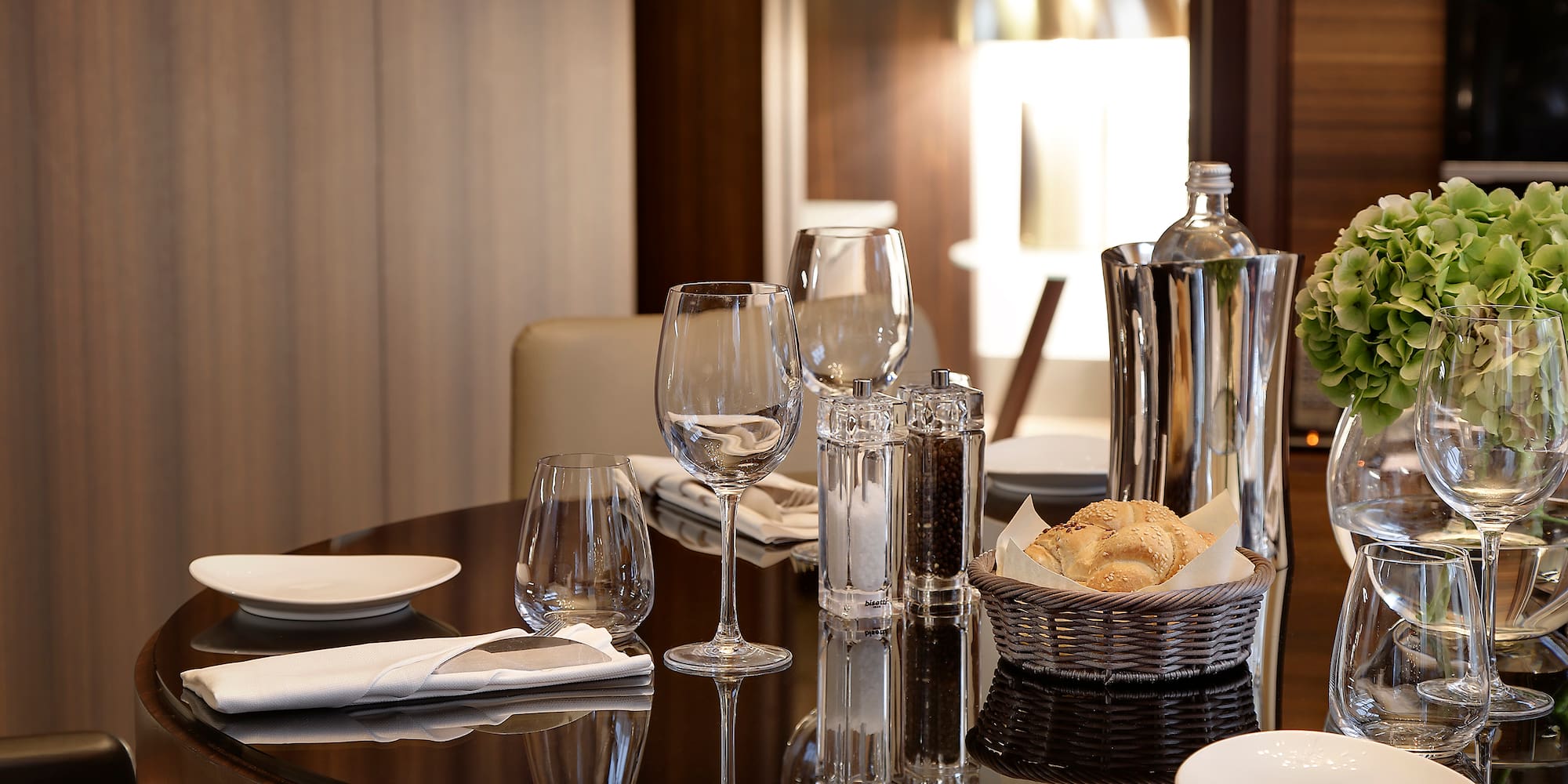 a table with glasses and plates