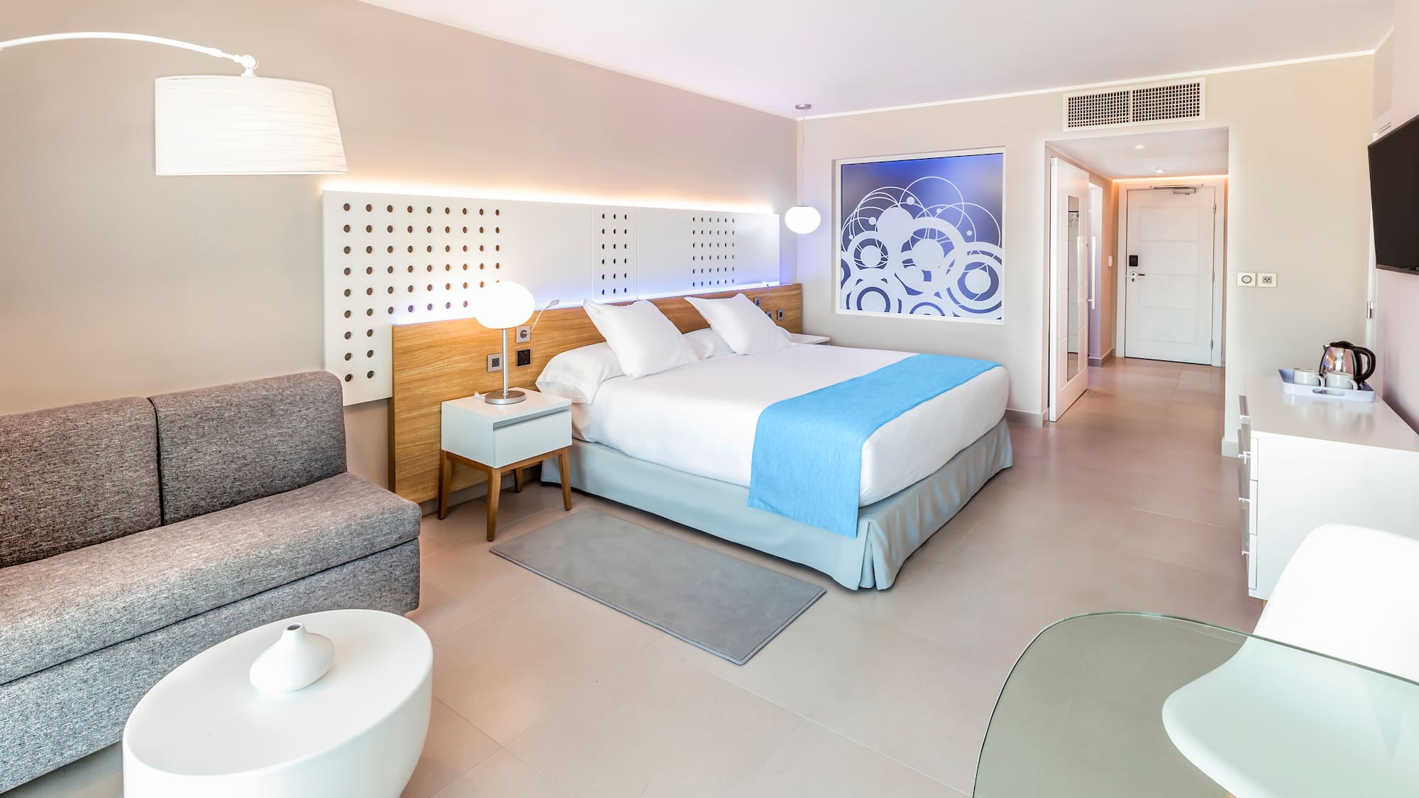 a bedroom with a bed and a couch