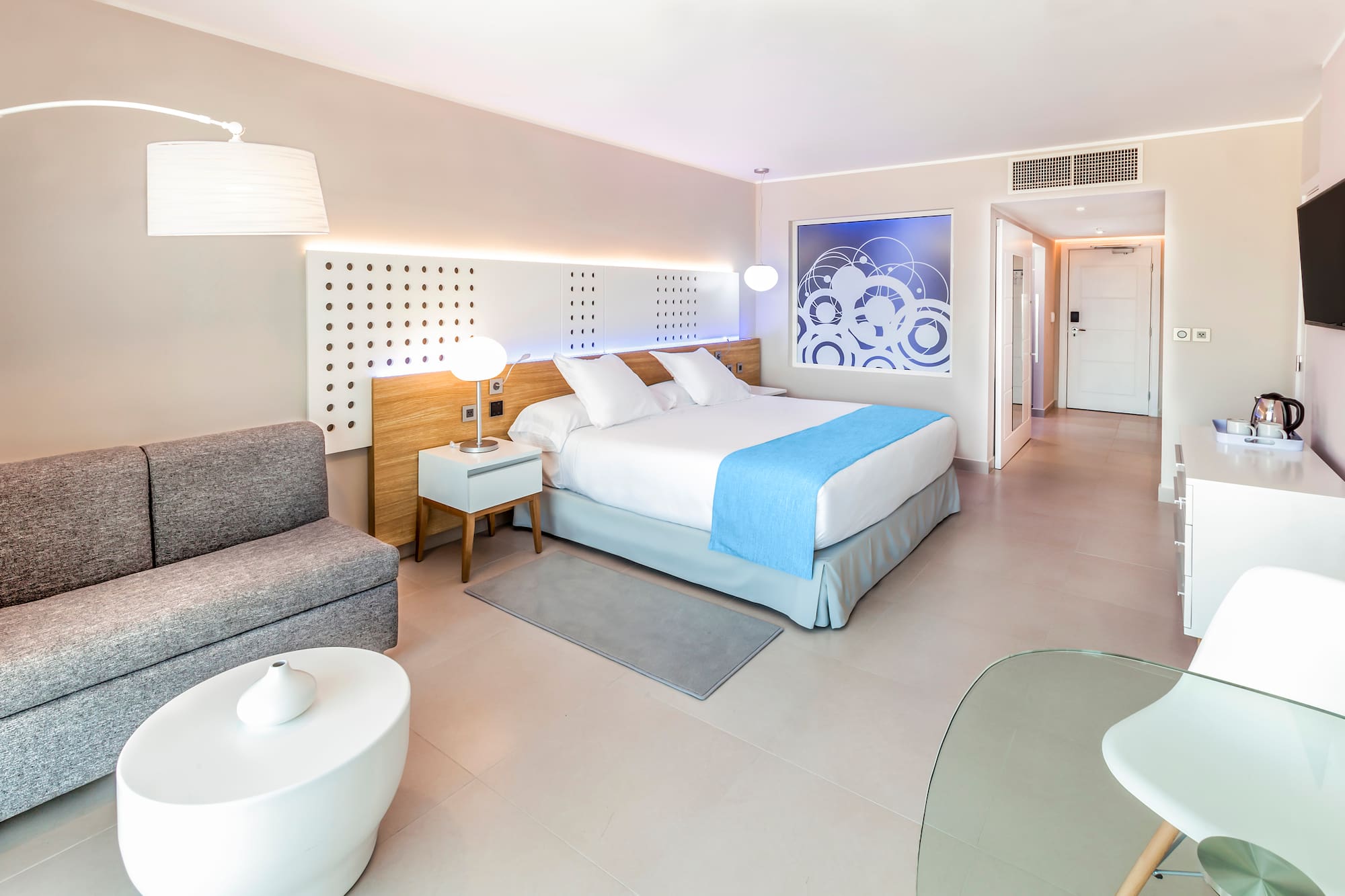 a bedroom with a bed and a couch