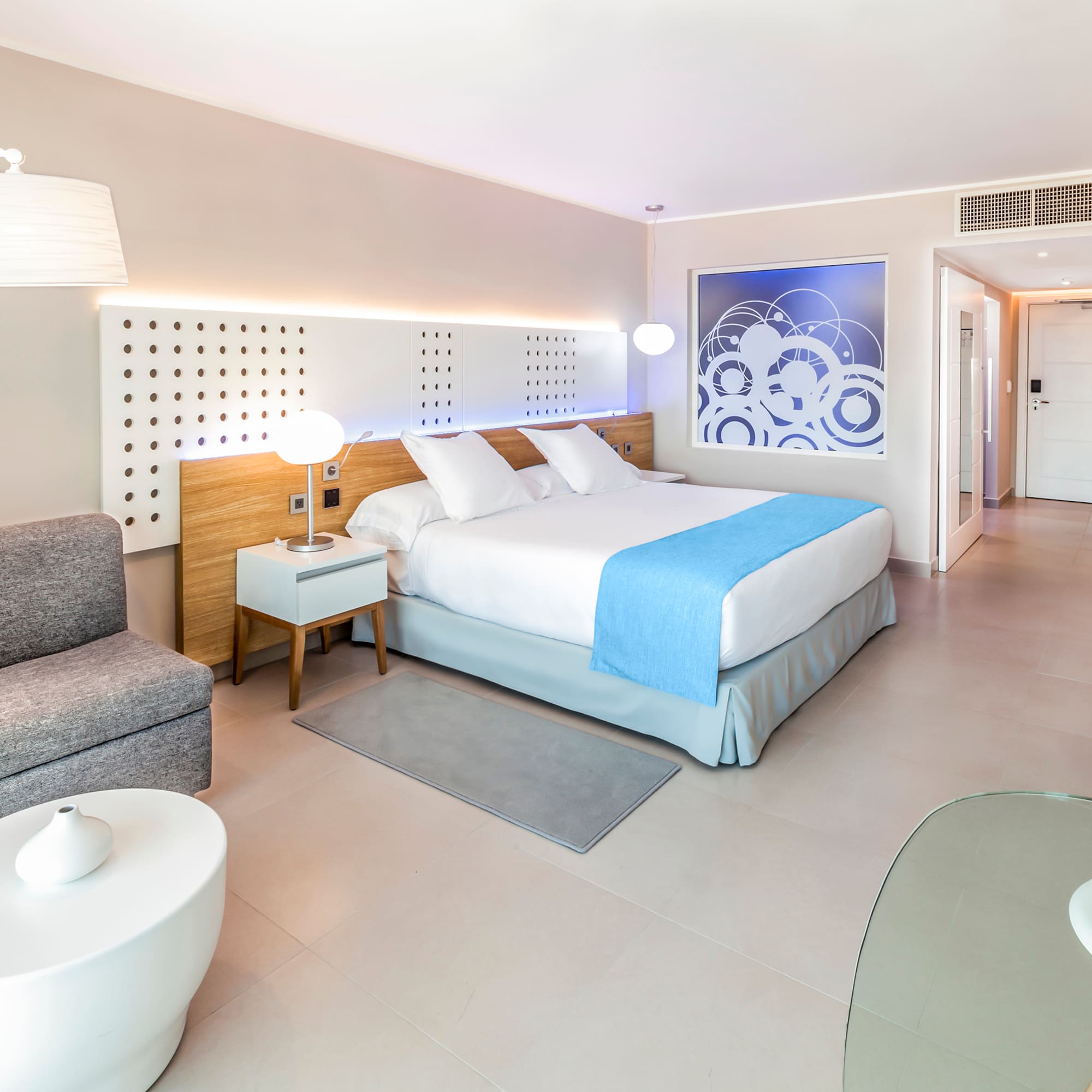 a bedroom with a bed and a couch