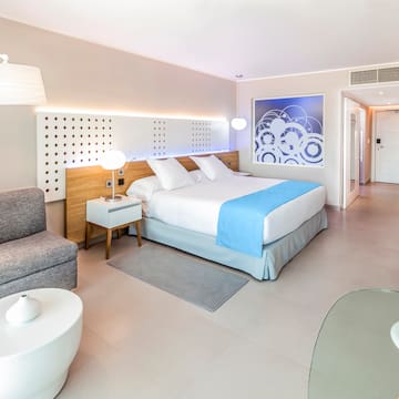 a bedroom with a bed and a couch