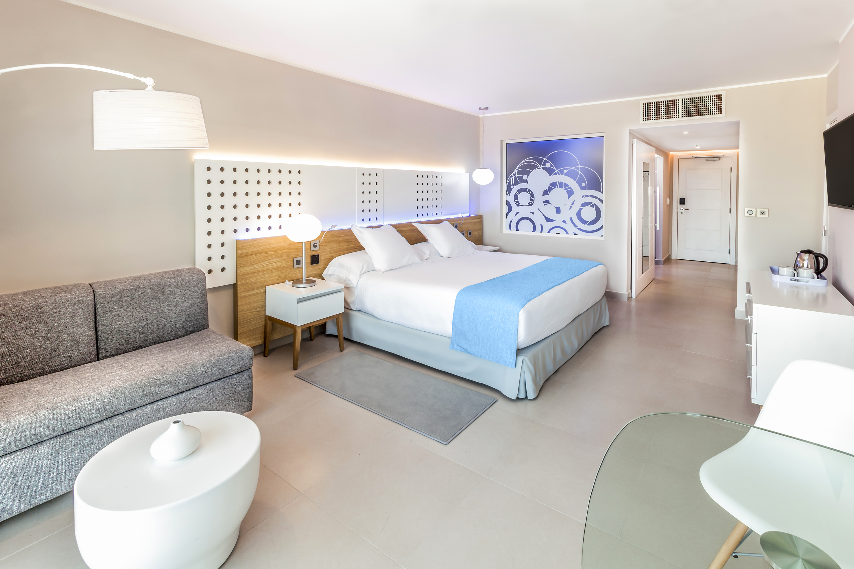 a bedroom with a bed and a couch