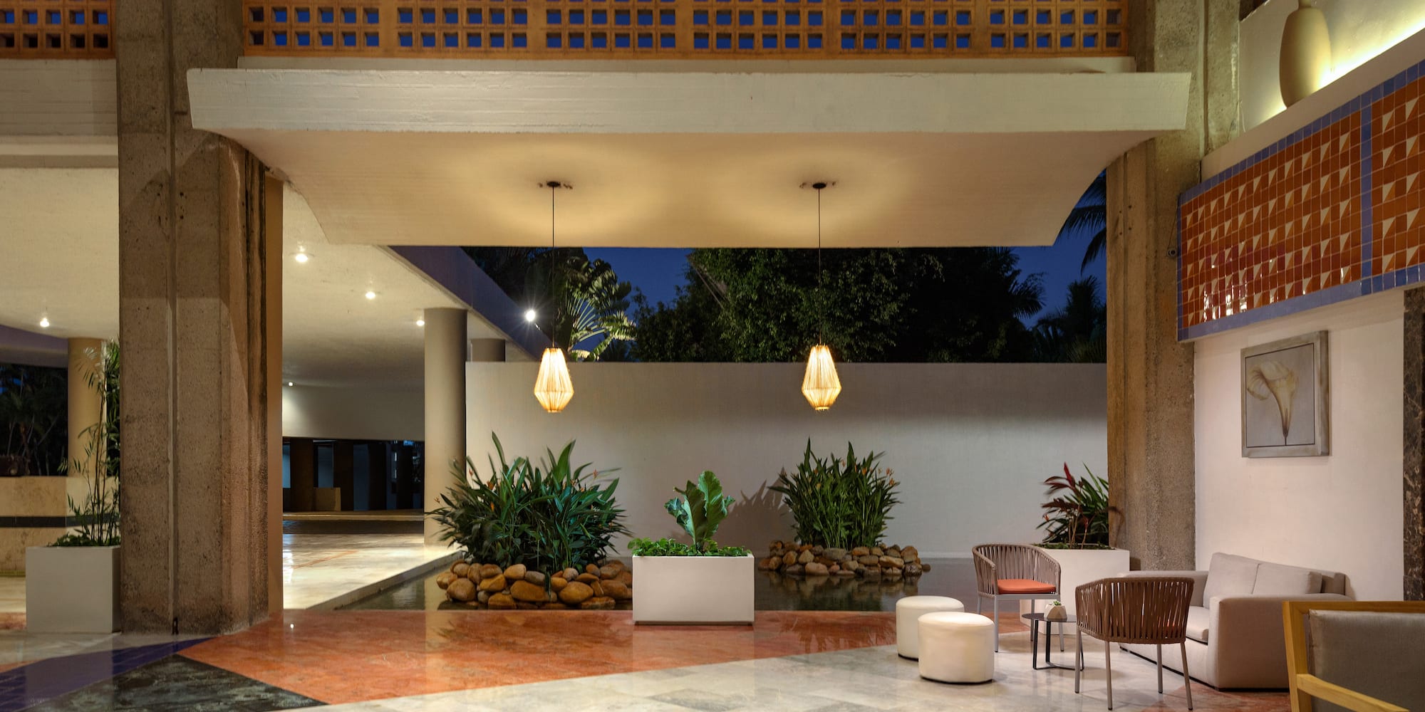 a patio with plants and a stone floor