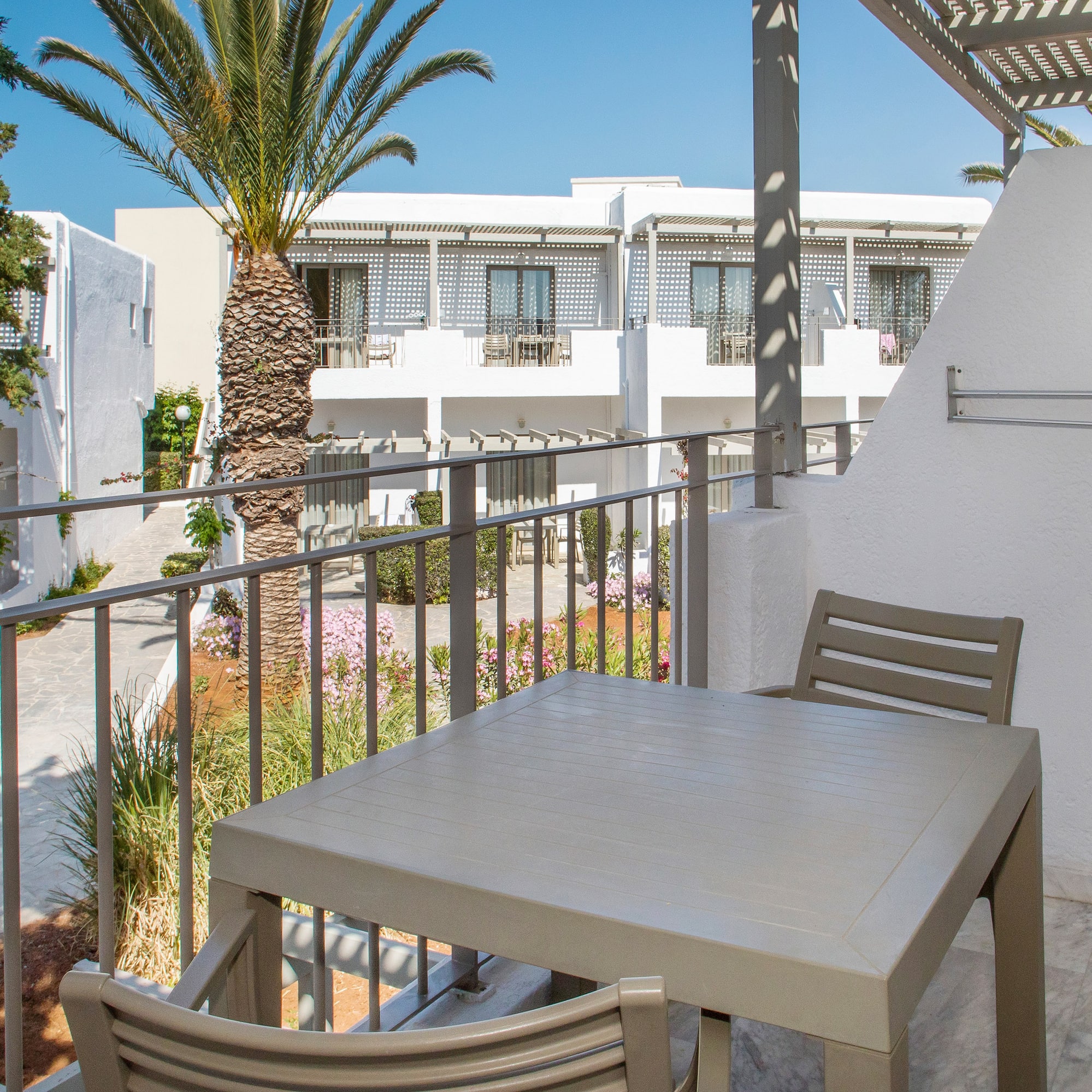a table and chairs on a balcony