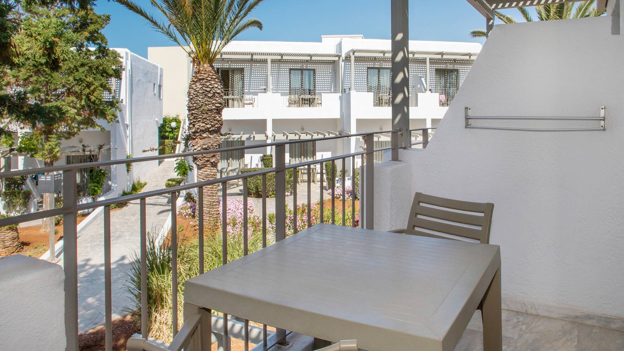 a table and chairs on a balcony