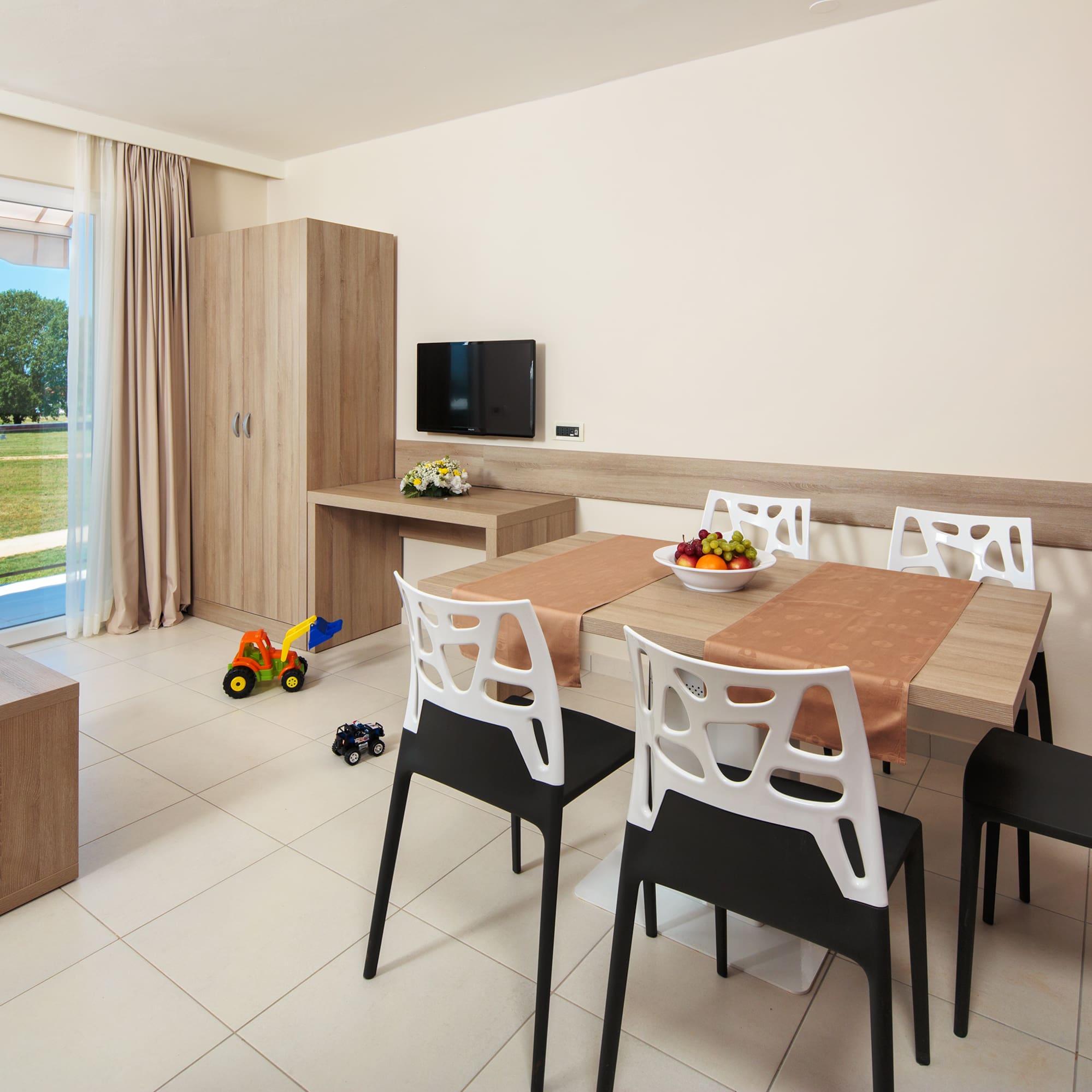 a room with a table and chairs