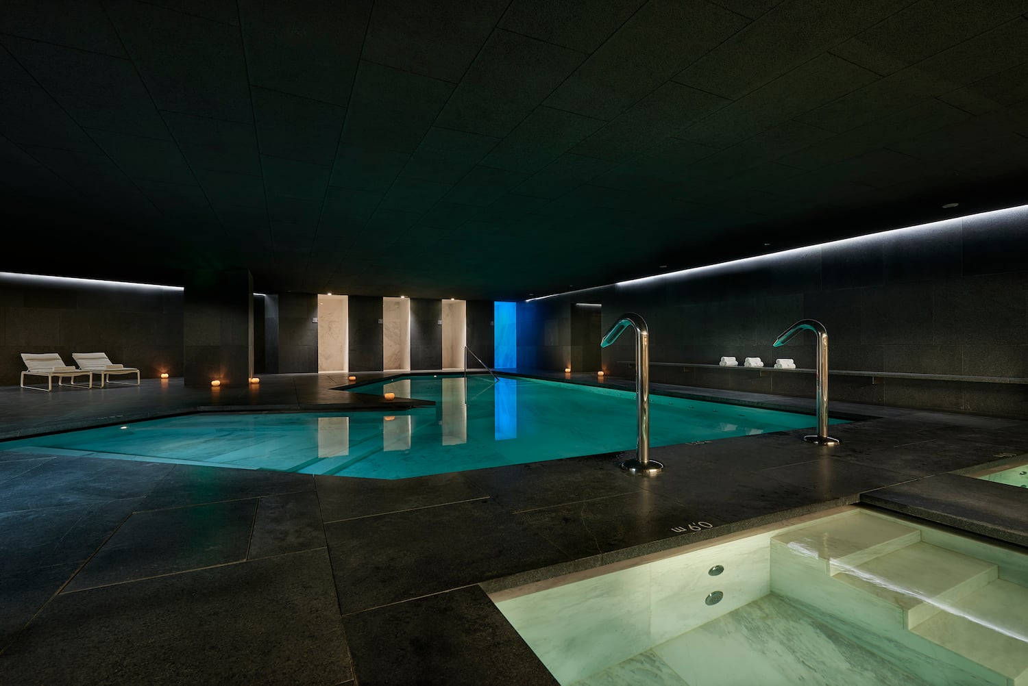a indoor pool with lights