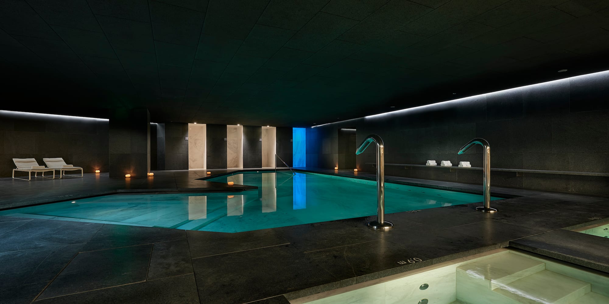 a indoor pool with lights