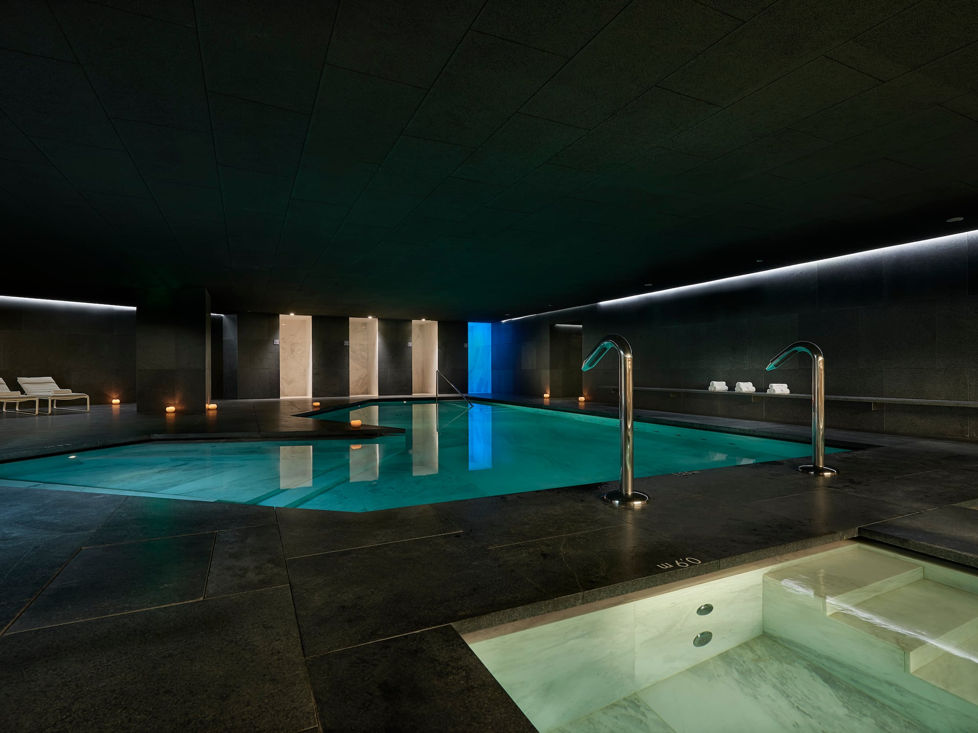 a indoor pool with lights