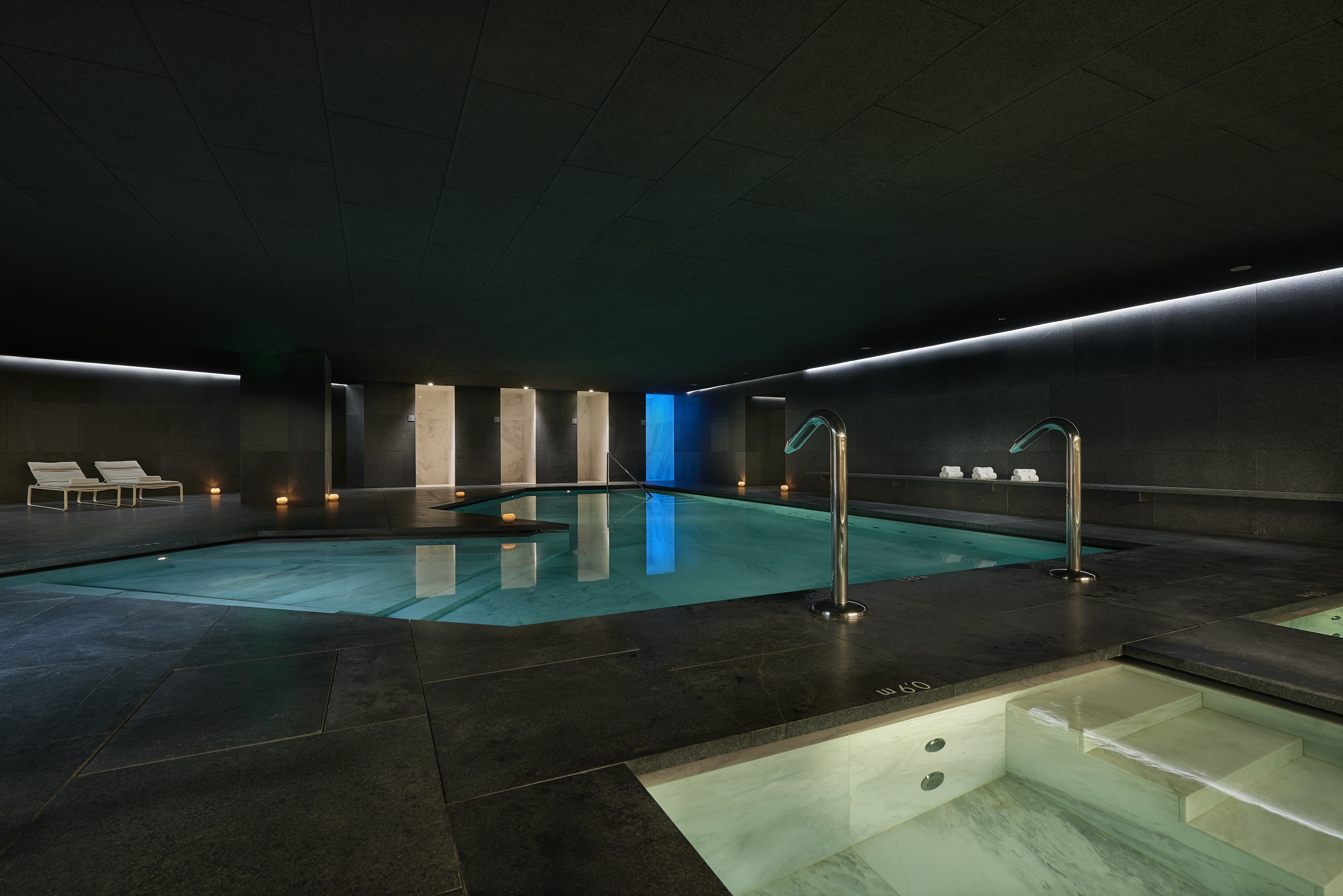 a indoor pool with lights