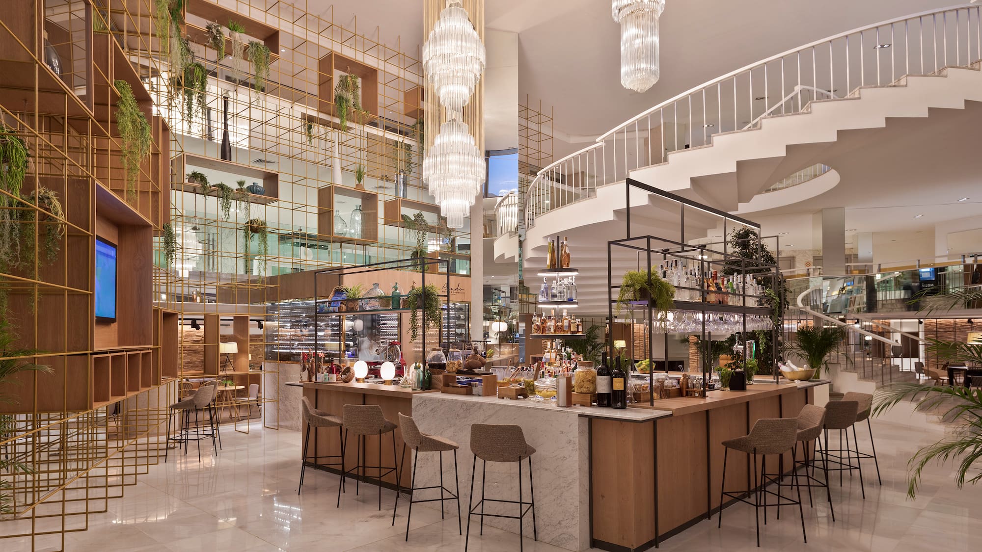 a large room with a staircase and a bar