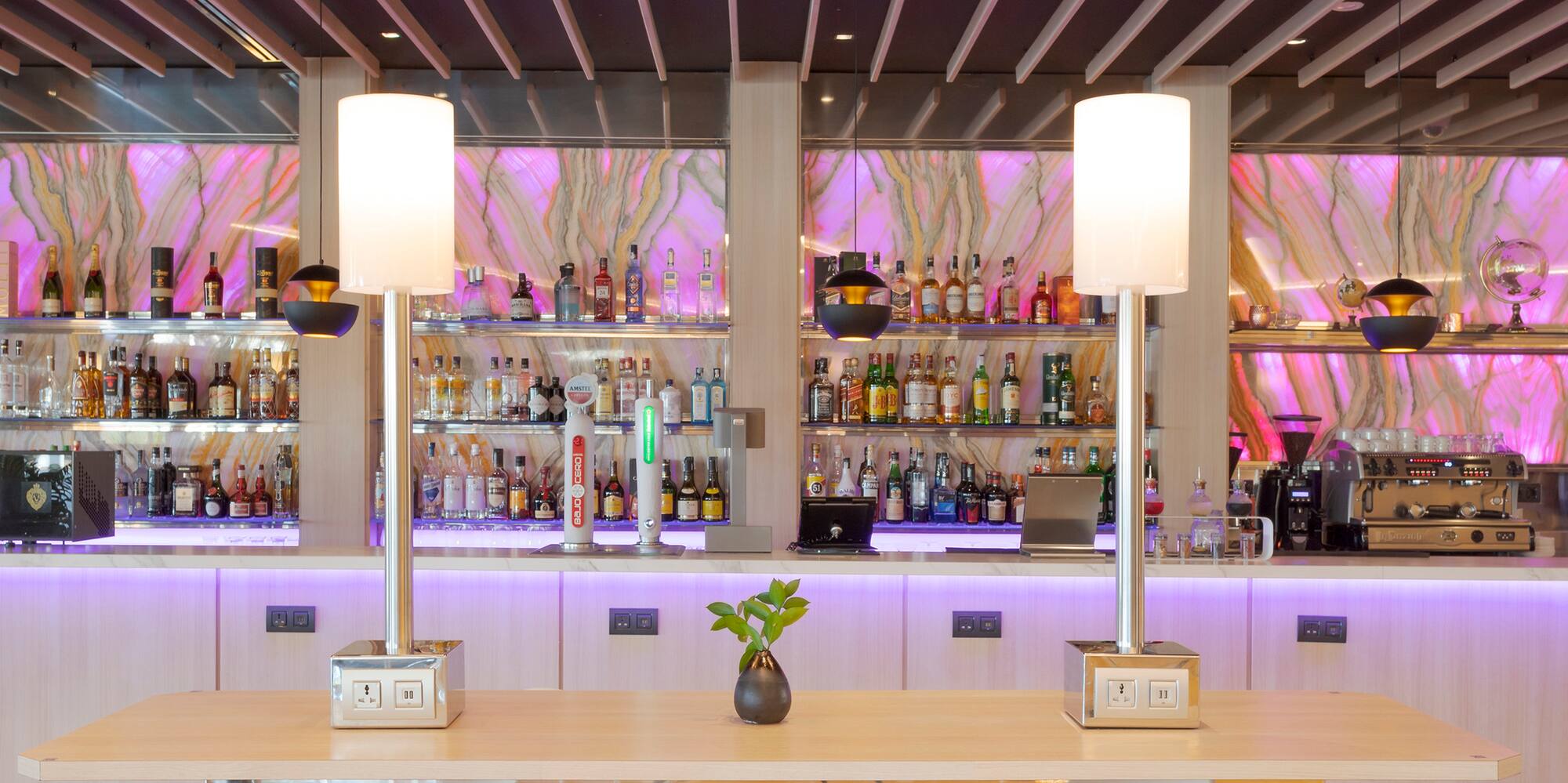 a bar with a table and chairs