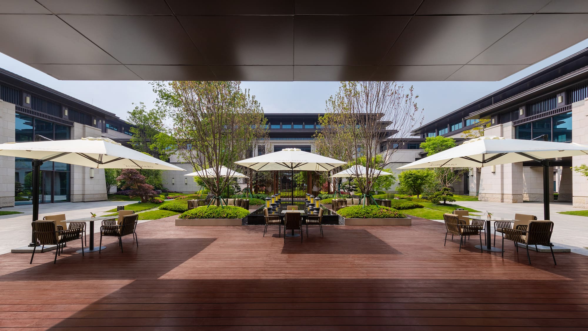 a patio with umbrellas and chairs