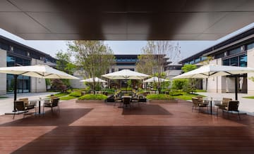 a patio with umbrellas and chairs