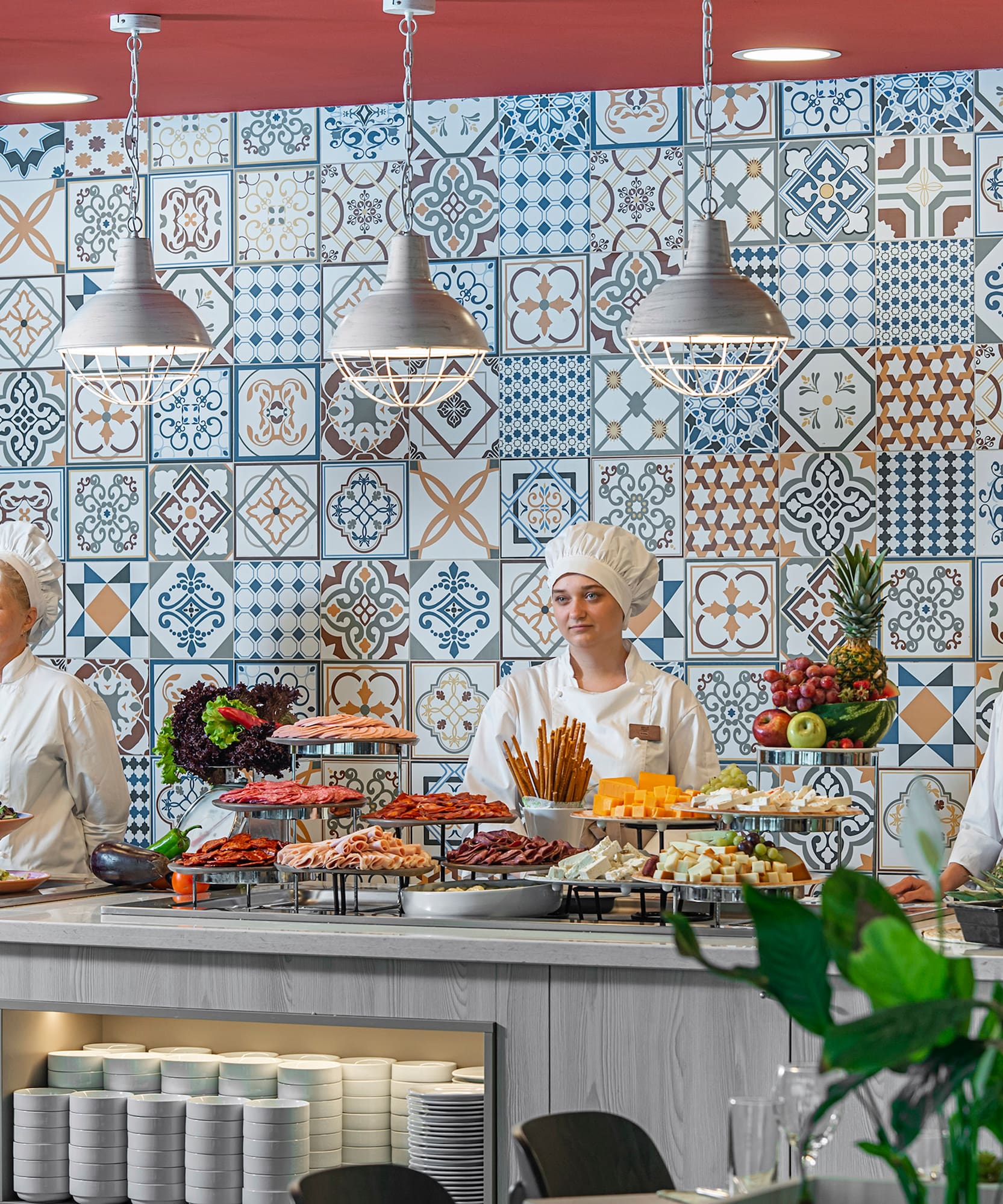 a group of people in chef's uniforms standing behind a counter