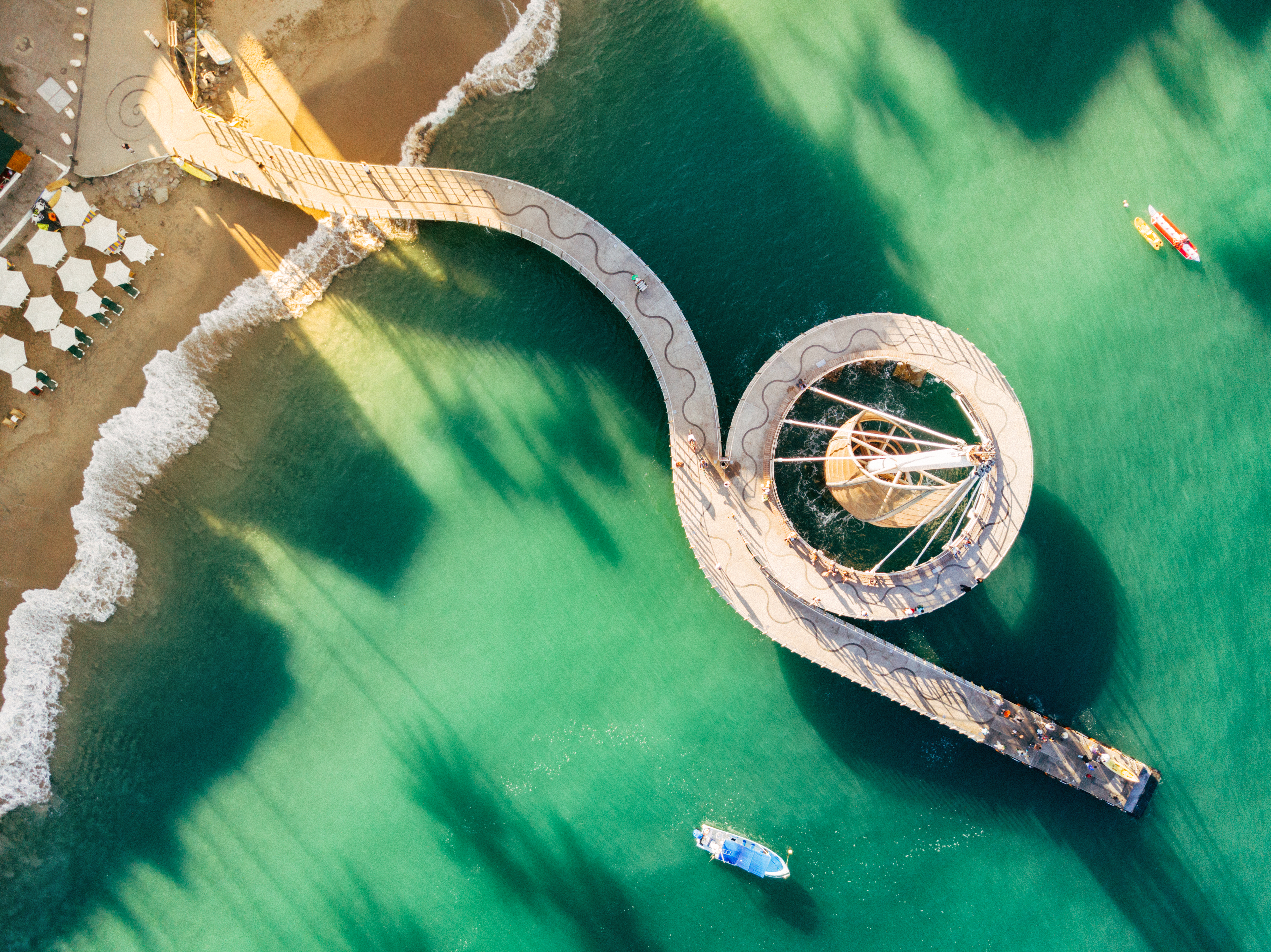 a bridge over water with a boat