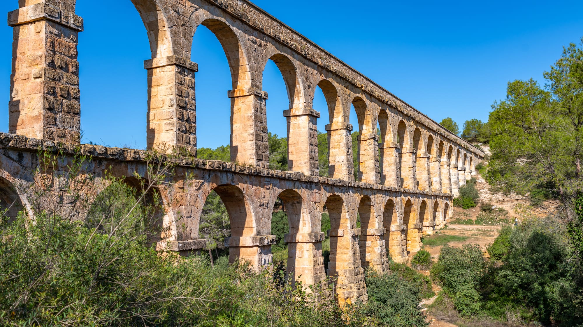 a stone bridge with arches