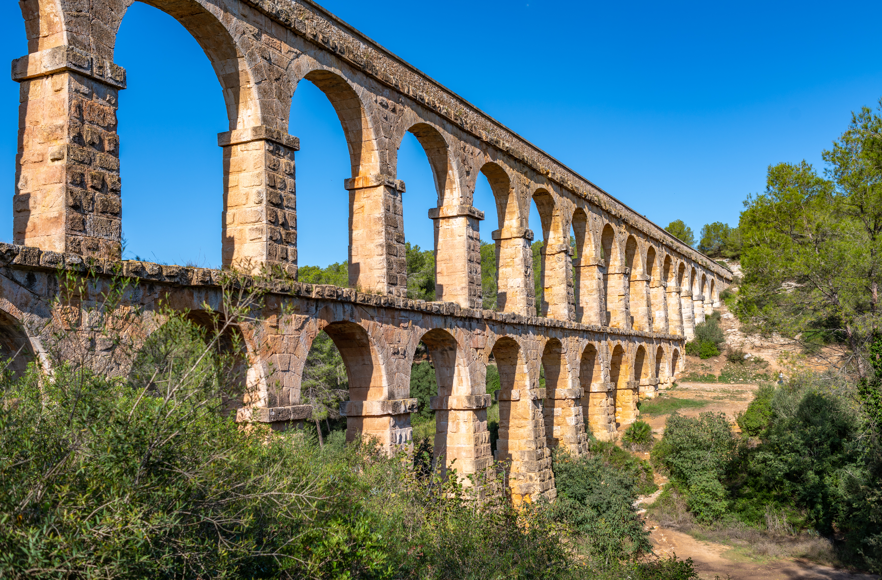 a stone bridge with arches