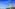 a river with a bridge and a city with towers