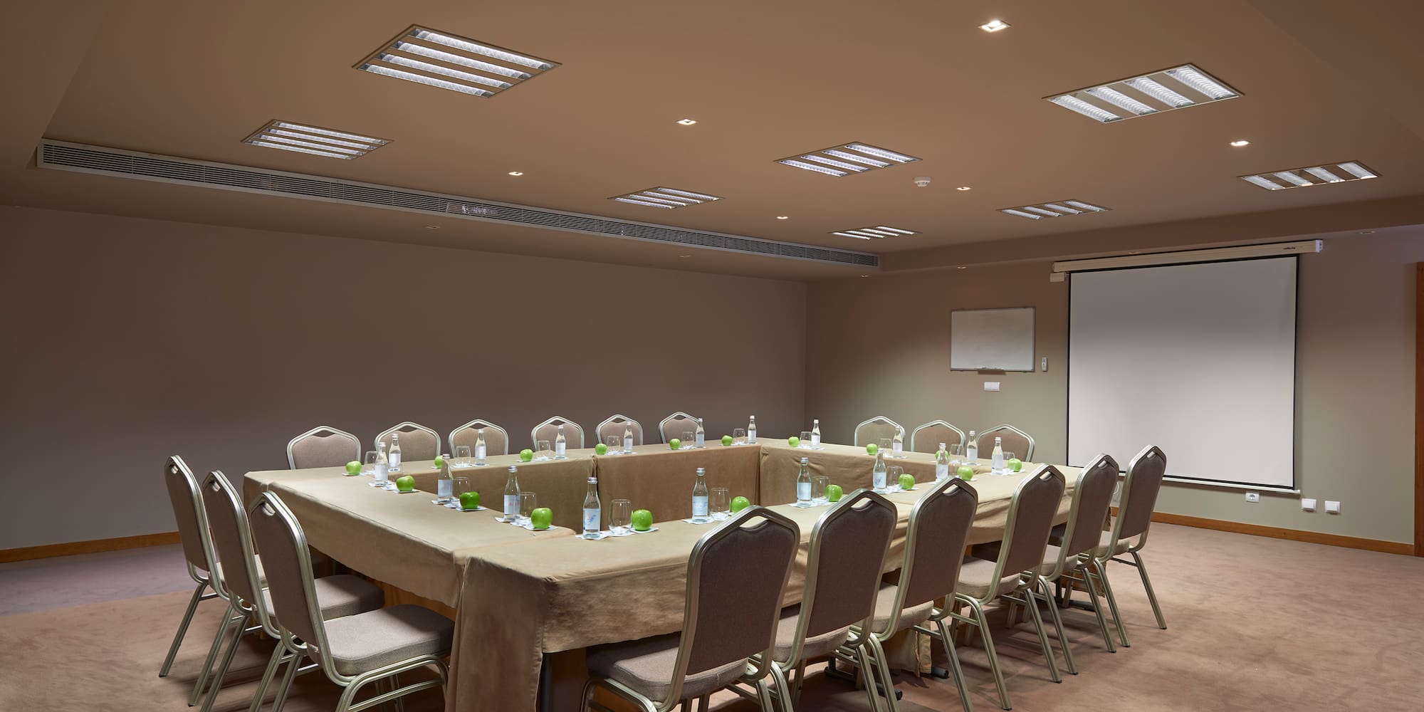 a conference room with a table and chairs