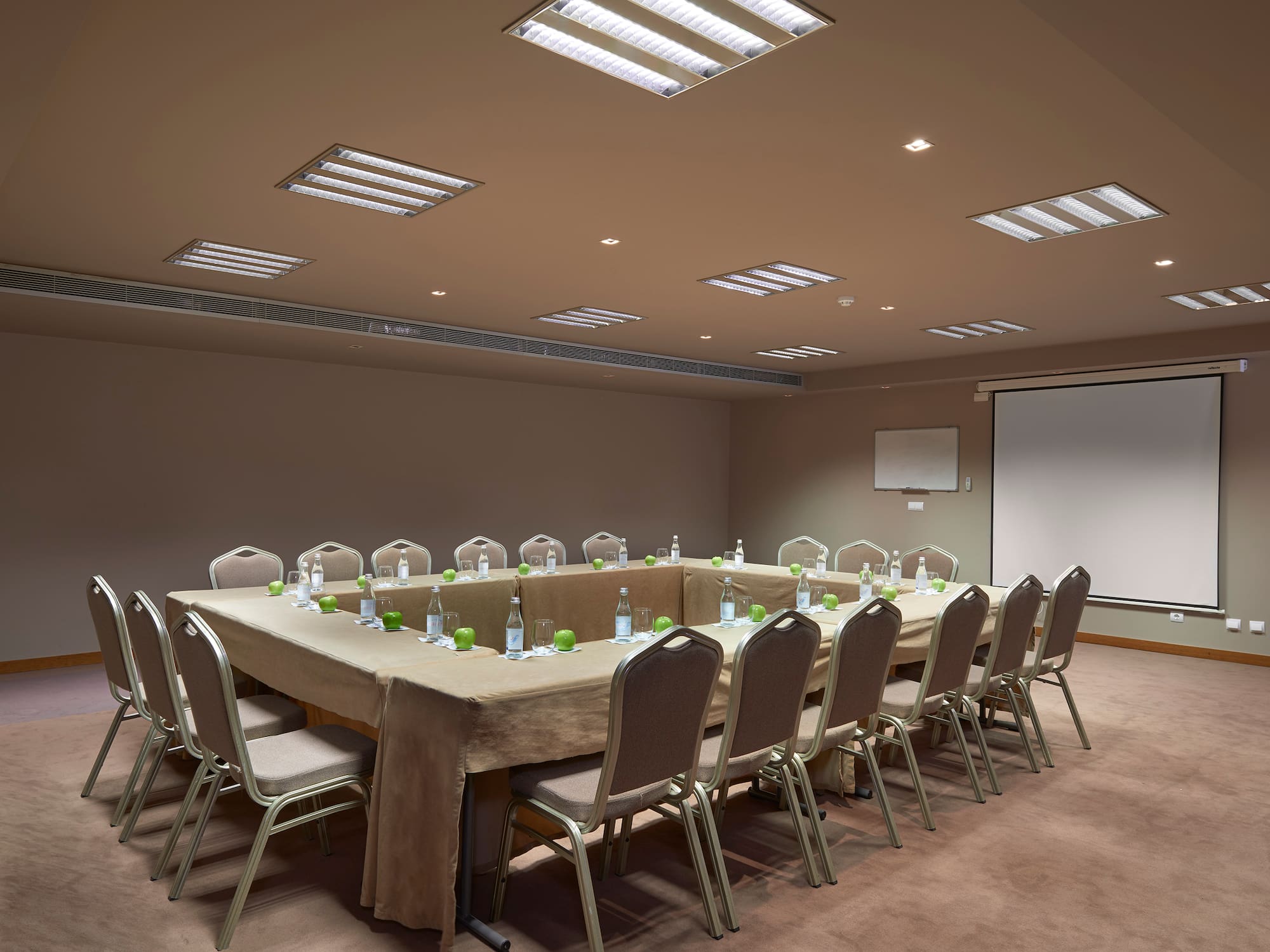 a conference room with a table and chairs