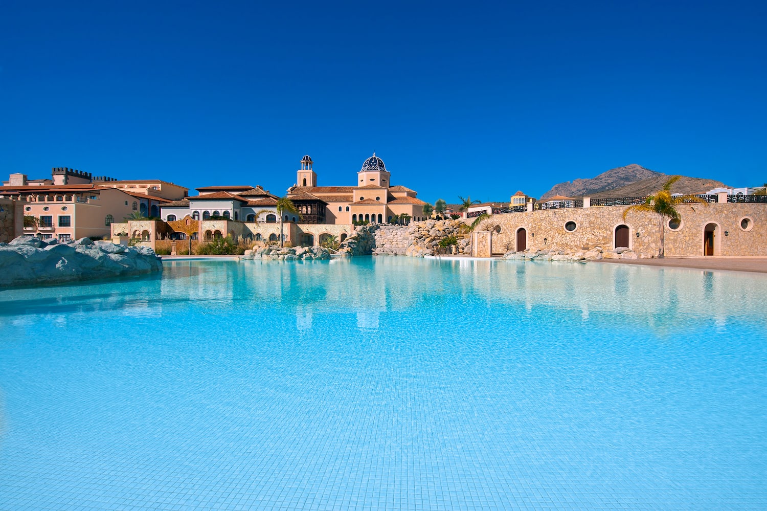 a pool with a building in the background