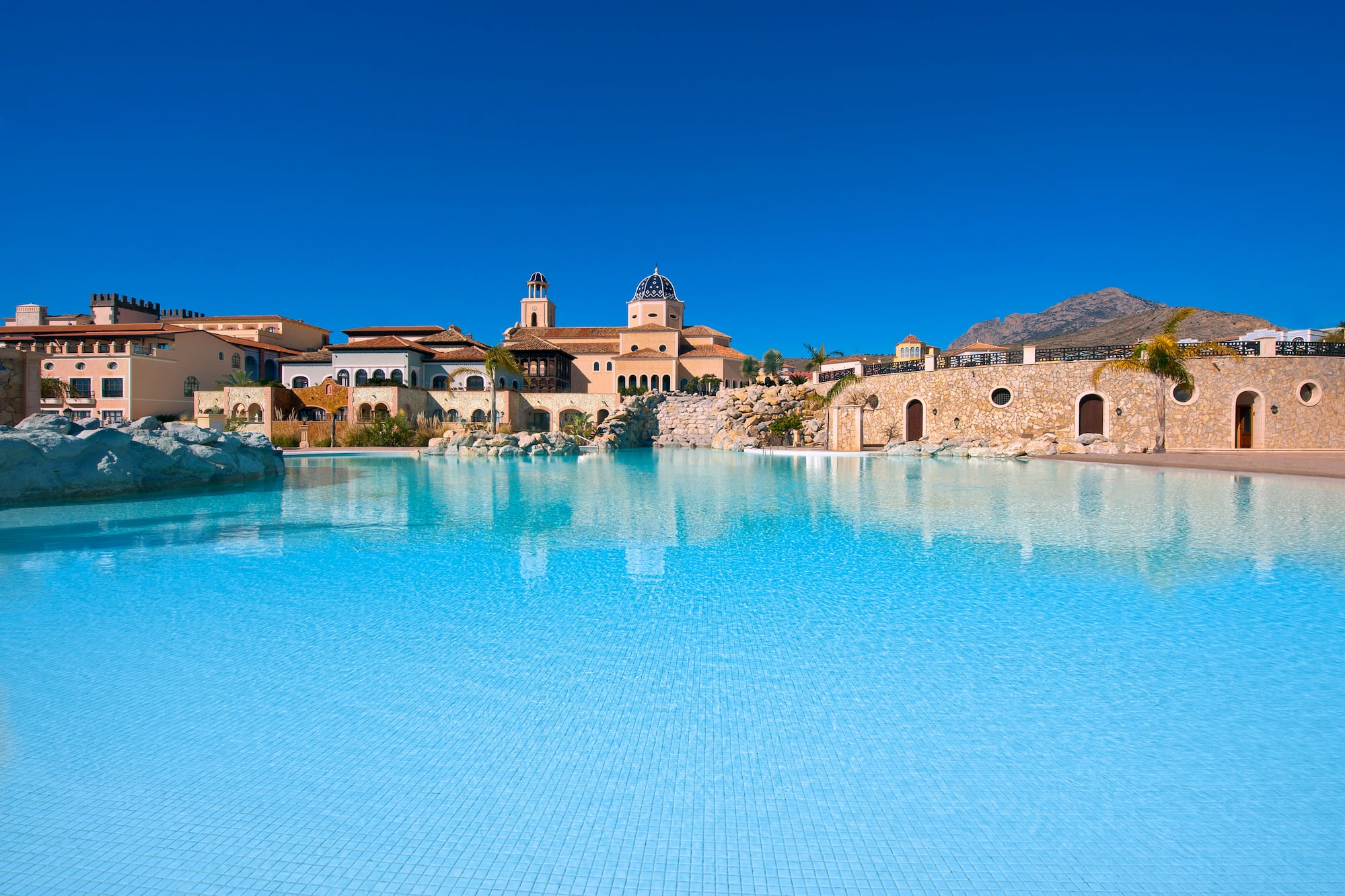 a pool with a building in the background