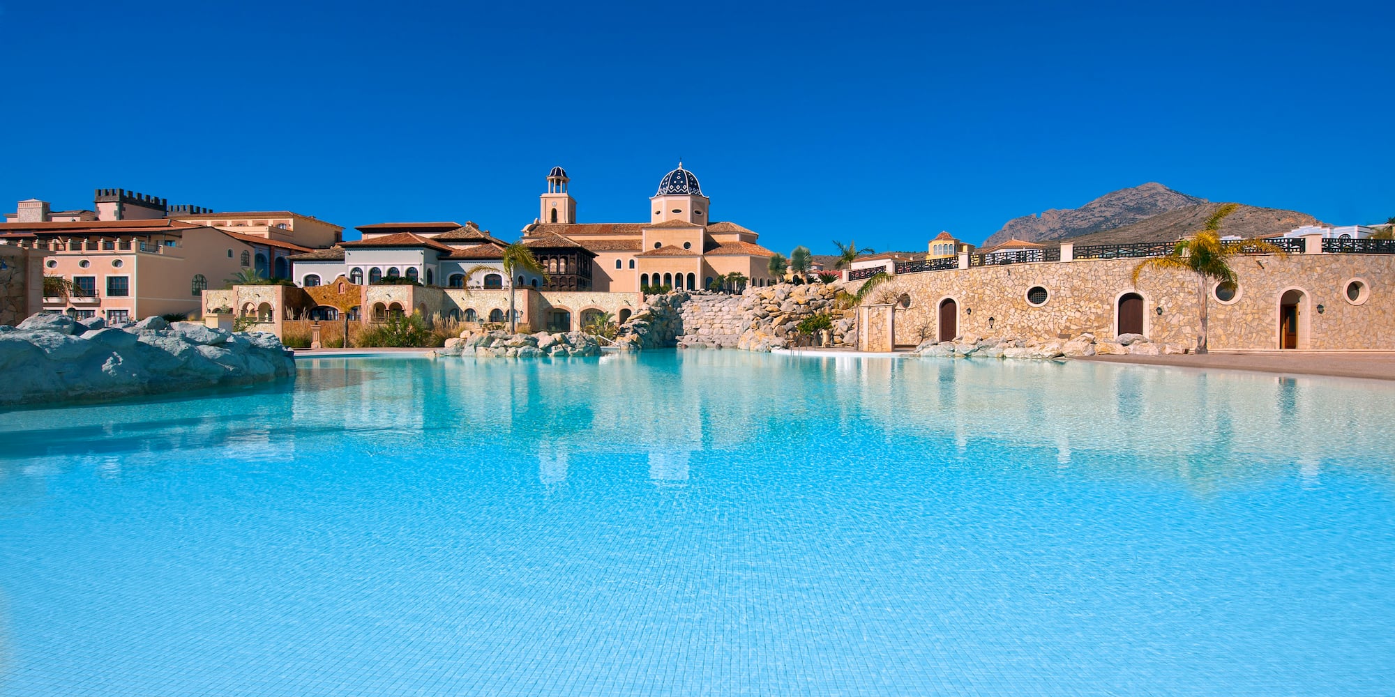 a pool with a building in the background