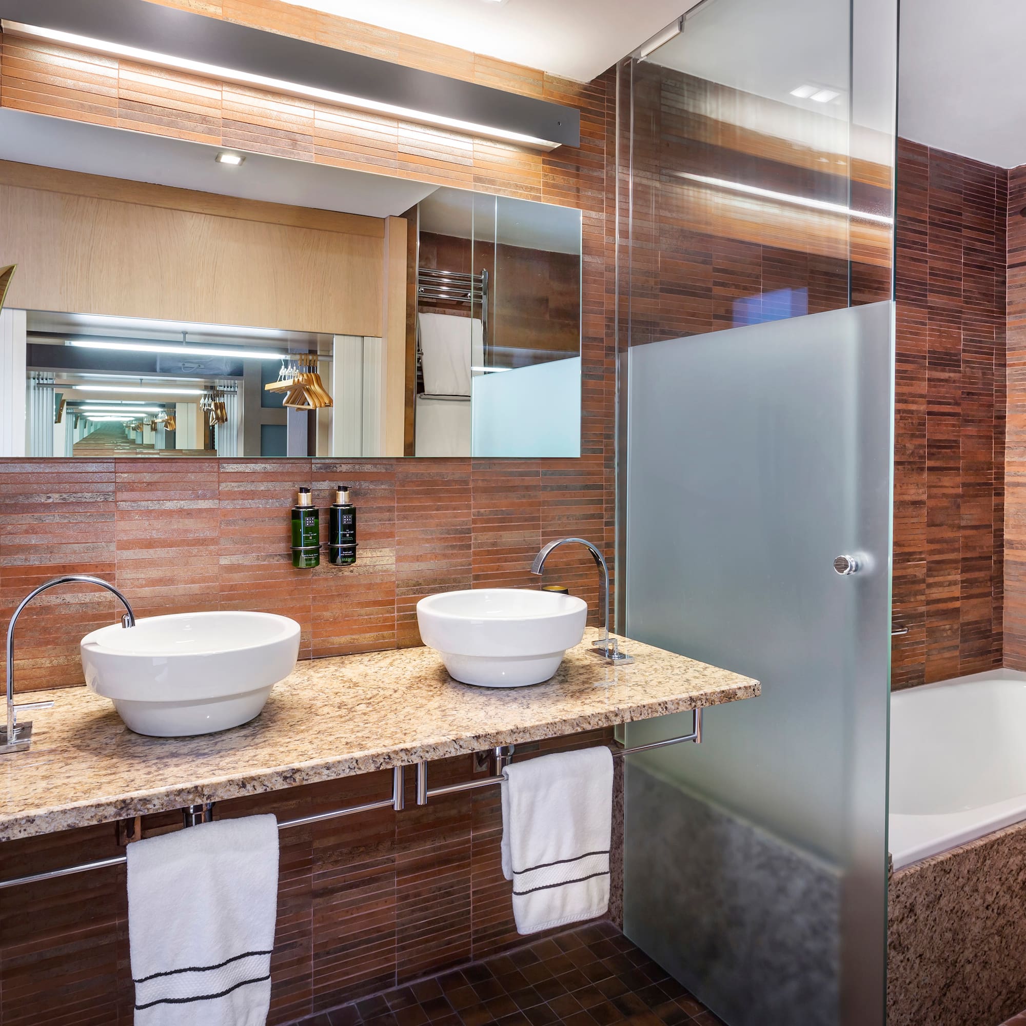 a bathroom with a shower and sink