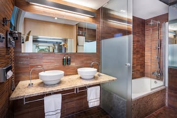 a bathroom with a shower and sink