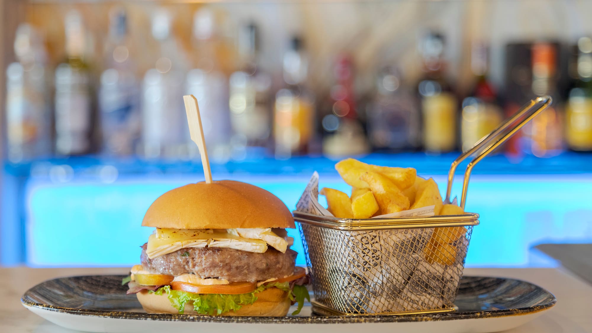 a burger and fries on a plate