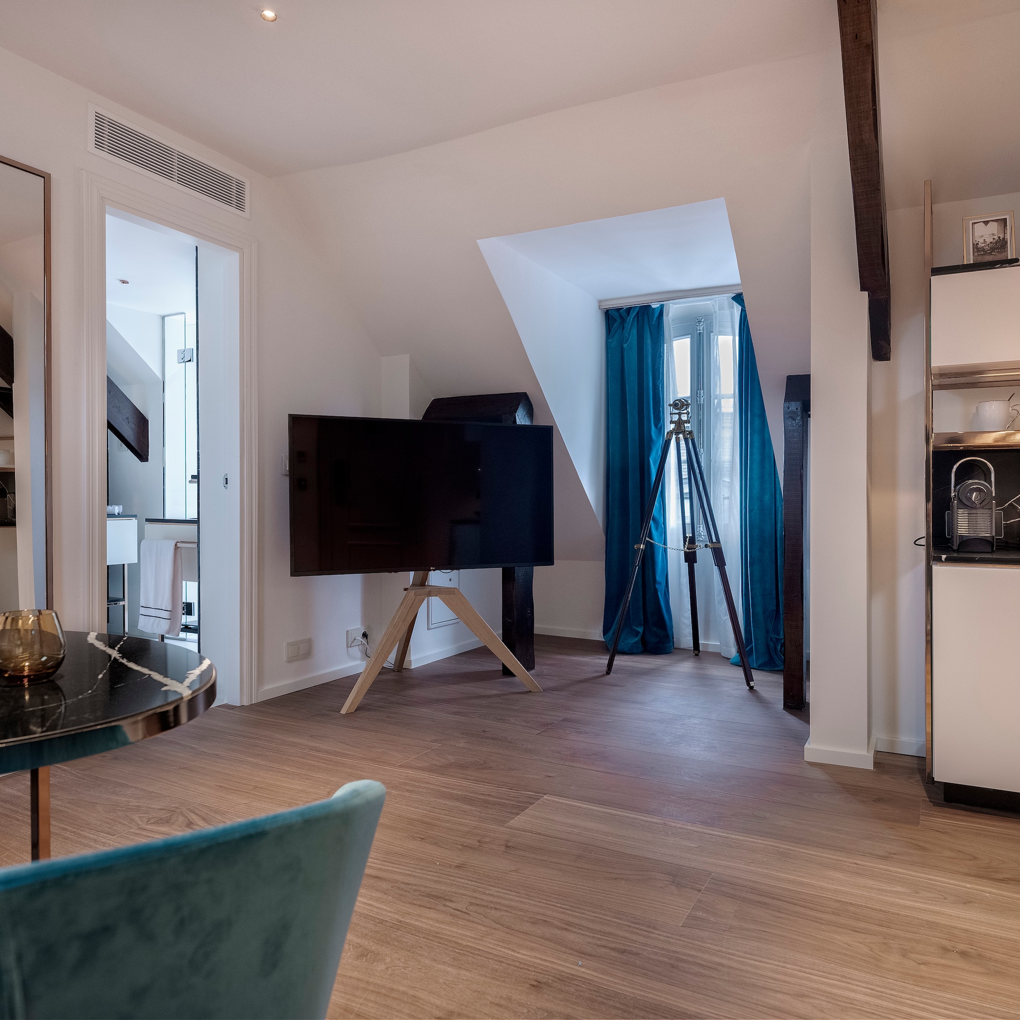 a room with a television on a tripod