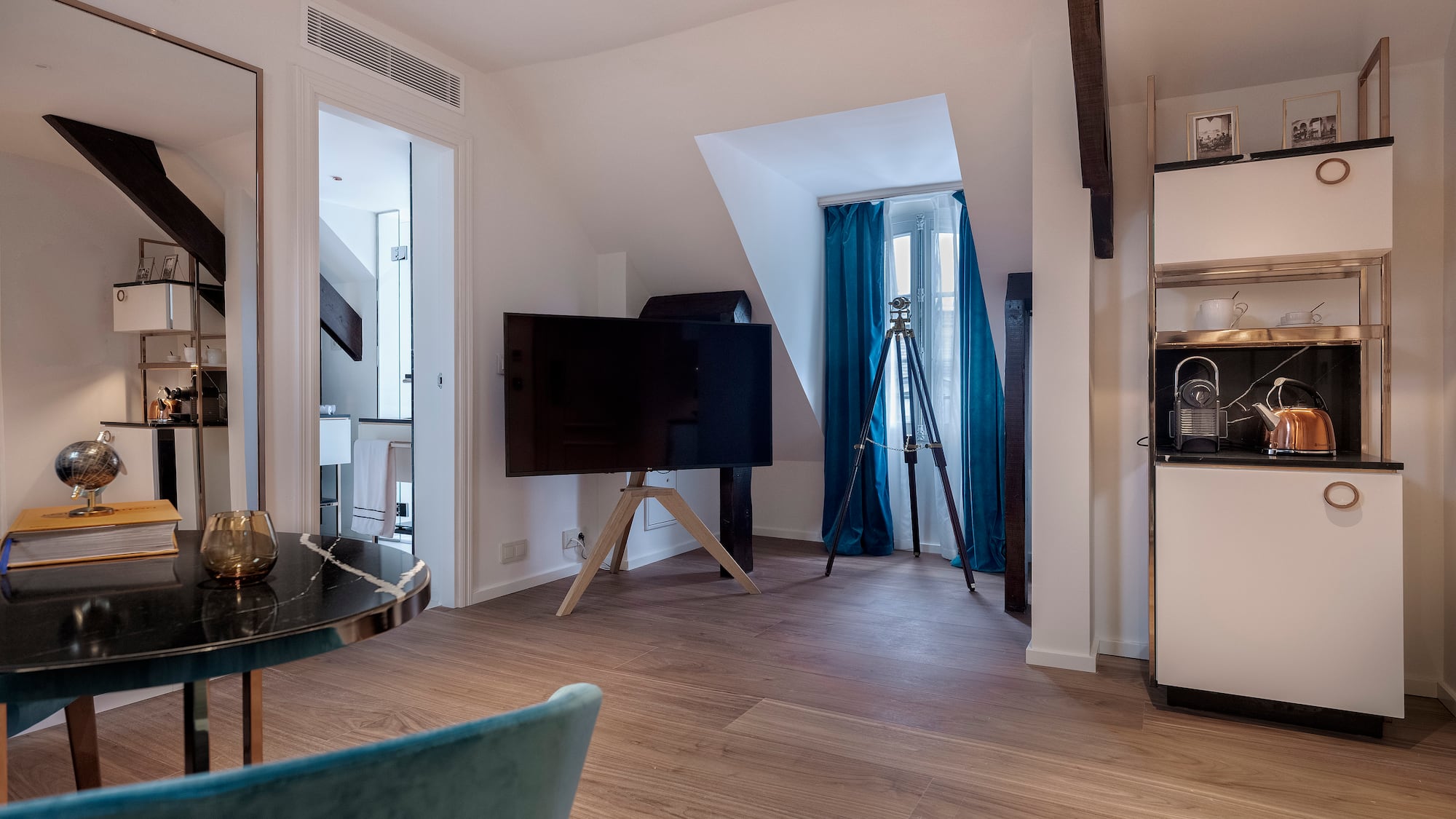 a room with a television on a tripod