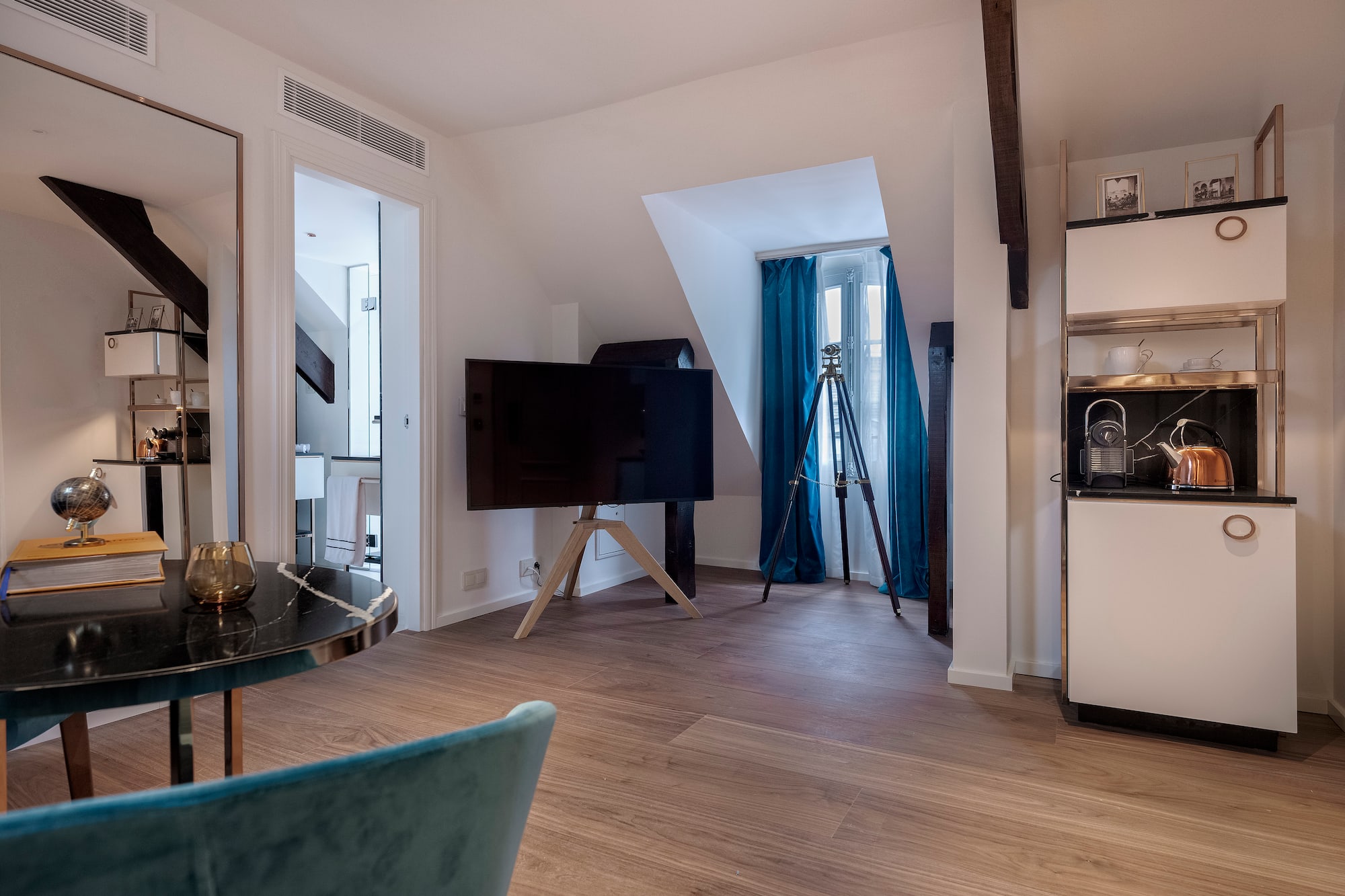 a room with a television on a tripod