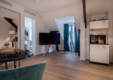 a room with a television on a tripod