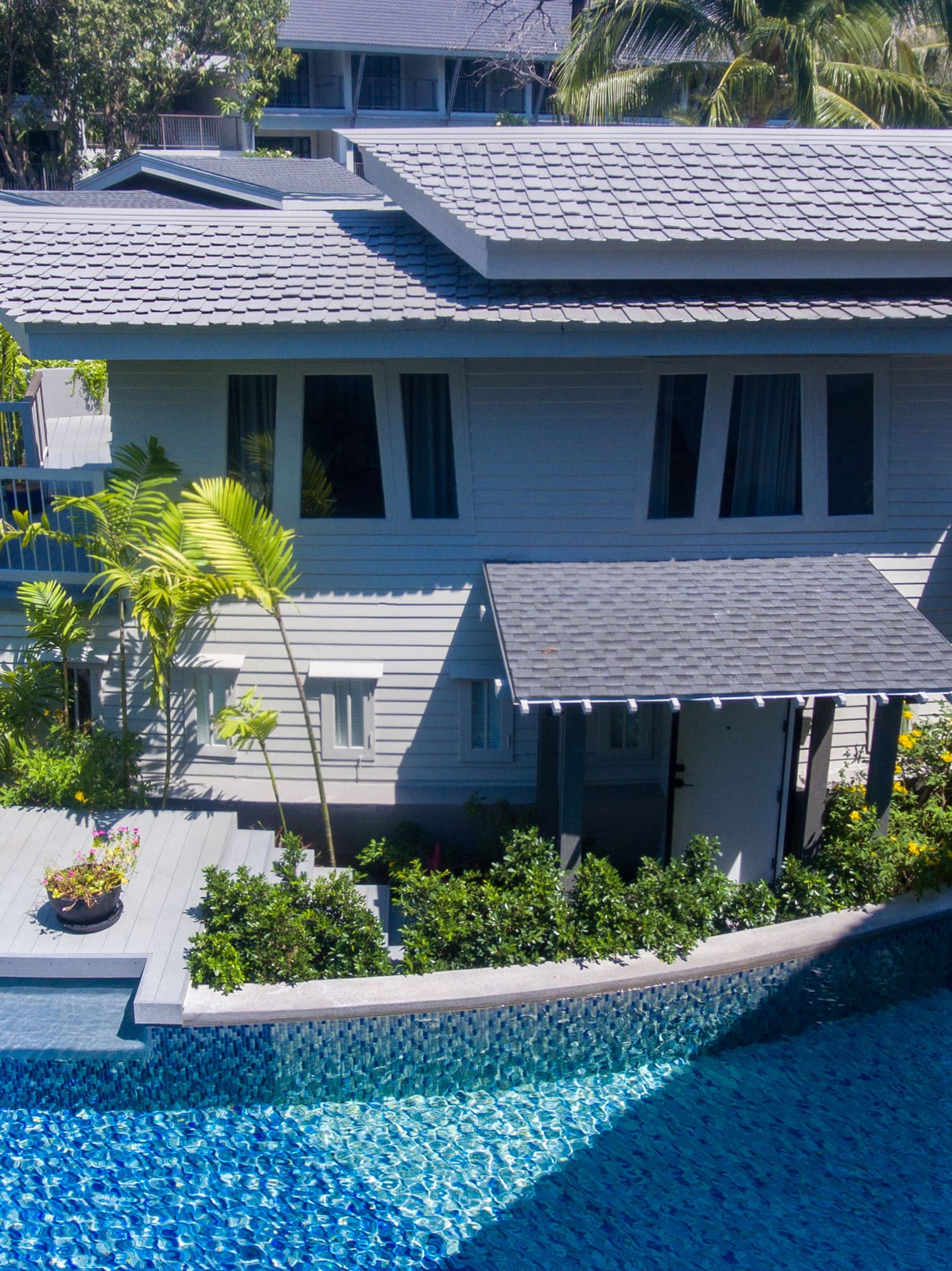 a house with a pool in the background