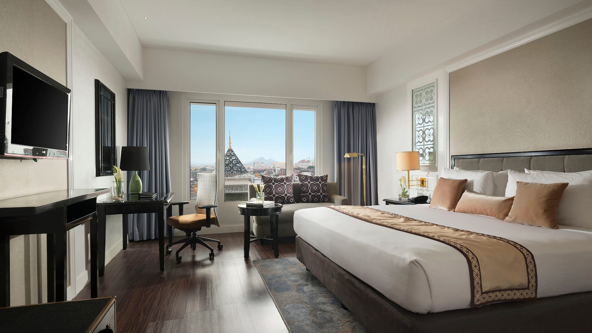 a bedroom with a large bed and a piano