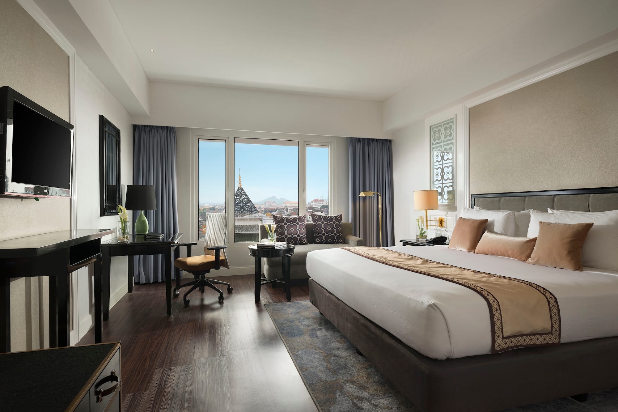 a bedroom with a large bed and a piano