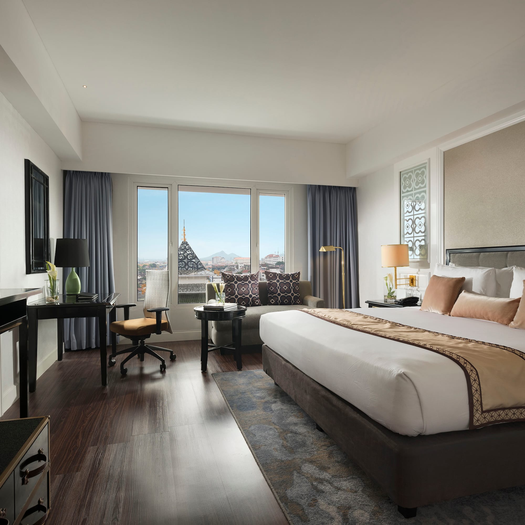 a bedroom with a large bed and a piano