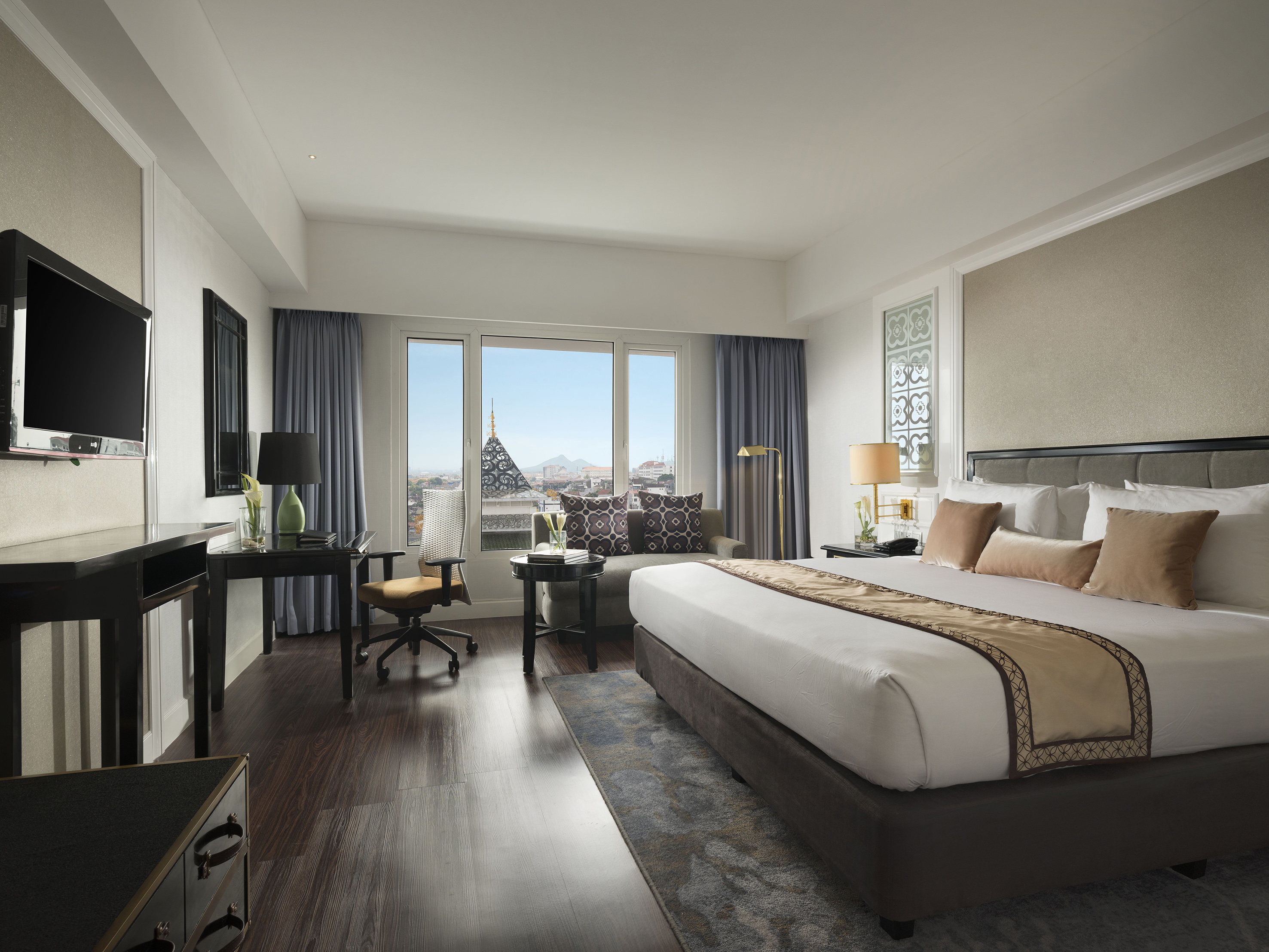 a bedroom with a large bed and a piano