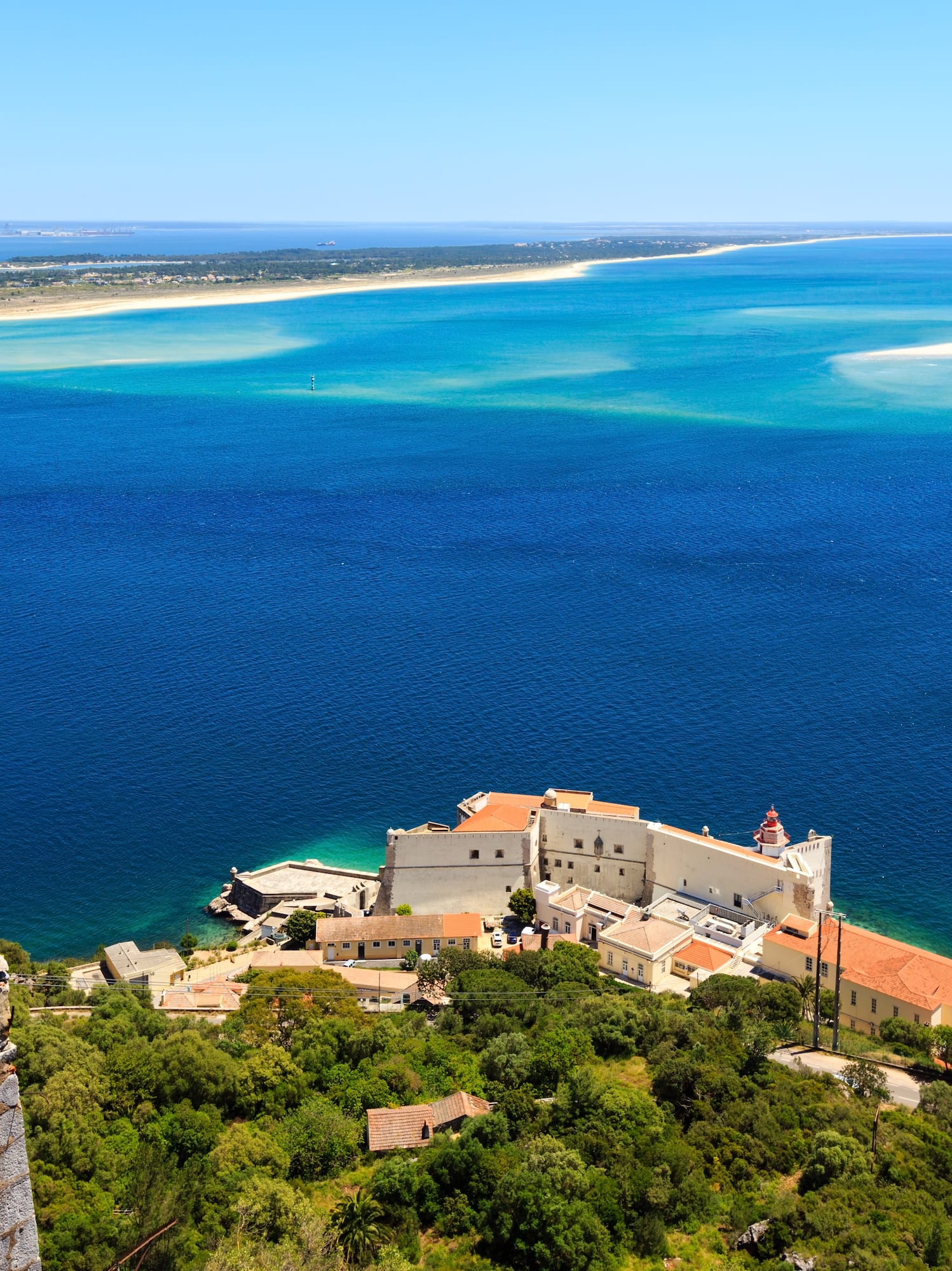 a building on the edge of a body of water