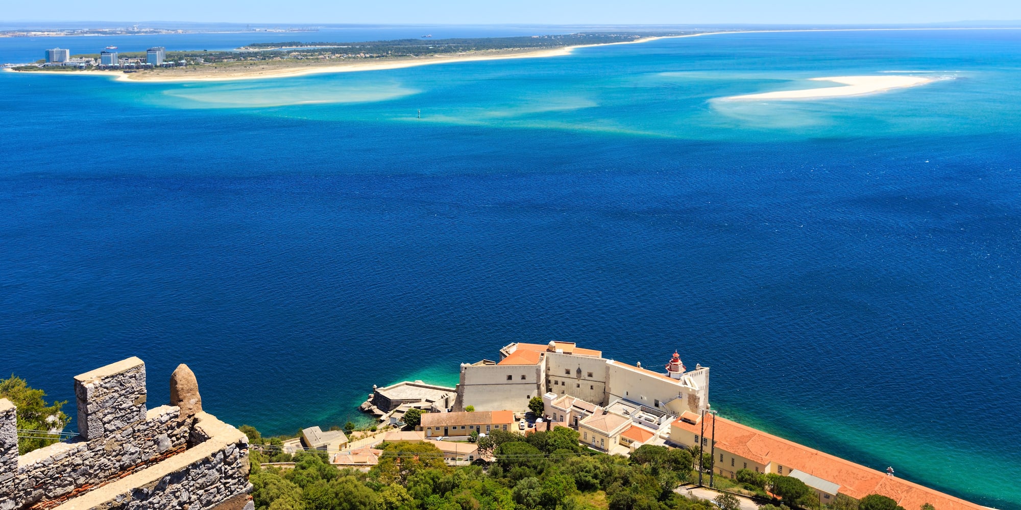 a building on the edge of a body of water