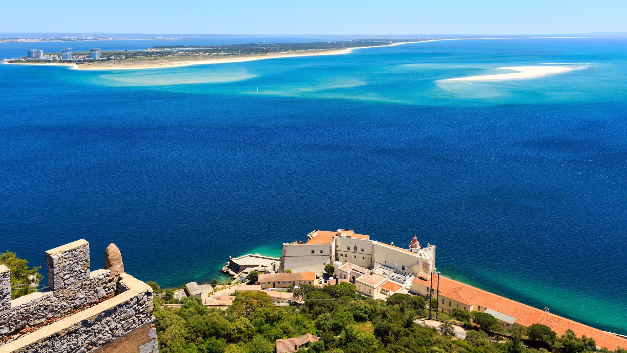 a building on the edge of a body of water